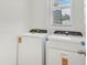 Laundry room with a window and new washer and dryer at 3189 Viceroy Ct, Poinciana, FL 34759