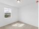 Neutral bedroom with natural light, carpeted floor and modern ceiling light at 3190 Viceroy Ct, Poinciana, FL 34759