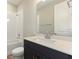 Bright bathroom features vanity with stone countertop, toilet, and tub with shower at 360 Birkdale Dr, Daytona Beach, FL 32124