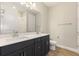 Modern bathroom features double vanity, quartz countertop and wood-look tile flooring at 360 Birkdale Dr, Daytona Beach, FL 32124