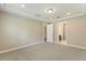 Spacious bedroom with neutral carpet and ensuite bath and closet access at 360 Birkdale Dr, Daytona Beach, FL 32124