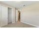 Cozy bedroom featuring neutral carpet, walk-in closet, and ceiling light at 360 Birkdale Dr, Daytona Beach, FL 32124