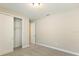 Cozy bedroom featuring neutral carpet, walk-in closet and a ceiling light at 360 Birkdale Dr, Daytona Beach, FL 32124