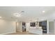 Modern kitchen featuring stainless steel appliances, a center island, and elegant dark blue cabinetry at 360 Birkdale Dr, Daytona Beach, FL 32124