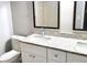 Modern bathroom features white vanity with granite countertop and dual sinks at 4164 Plantation Village Condos Dr # 504, Orlando, FL 32810