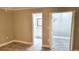 Bedroom featuring new flooring, neutral paint, and access to closets and bathrooms at 4164 Plantation Village Condos Dr # 504, Orlando, FL 32810