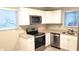 Updated kitchen featuring stainless steel appliances, granite countertops, and ample cabinet space at 4164 Plantation Village Condos Dr # 504, Orlando, FL 32810