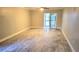 The living room has new flooring and a sliding glass door to the porch at 4164 Plantation Village Condos Dr # 504, Orlando, FL 32810