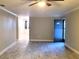 The living room features new flooring and a ceiling fan at 4164 Plantation Village Condos Dr # 504, Orlando, FL 32810