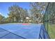 Outdoor basketball court surrounded by a chain-link fence with a colorful playing surface at 4532 Saddleworth Cir, Orlando, FL 32826