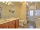 Bathroom featuring granite floors and a sink with a wood cabinet at 4532 Saddleworth Cir, Orlando, FL 32826