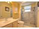 Bathroom featuring stone-look shower and vanity with sink at 4532 Saddleworth Cir, Orlando, FL 32826