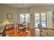 Cozy dining area with a round table, chairs, and view of the screened pool at 4532 Saddleworth Cir, Orlando, FL 32826