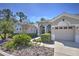 Beautiful single-story home with a well-manicured front yard, two-car garage and traditional architectural design at 4532 Saddleworth Cir, Orlando, FL 32826