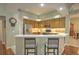 Kitchen with bar seating and stainless steel appliances at 4532 Saddleworth Cir, Orlando, FL 32826