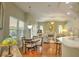 View of the sunny living room, dining area, and kitchen at 4532 Saddleworth Cir, Orlando, FL 32826