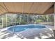 Enjoy this private screened pool with peaceful views of lush greenery at 4532 Saddleworth Cir, Orlando, FL 32826