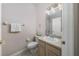 Bright bathroom with a shower, neutral-toned vanity and light fixtures, and tiled floors at 4865 Cypress Woods Dr # 2105, Orlando, FL 32811