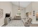 Comfortable living room featuring high ceilings, a ceiling fan, modern decor, and access to the outdoor patio at 5021 Sweet Leaf Ct, Altamonte Springs, FL 32714