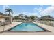 Large, sparkling community pool surrounded by lush landscaping and a covered seating area at 5021 Sweet Leaf Ct, Altamonte Springs, FL 32714