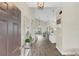 Inviting foyer with wood-look tile flooring, high ceilings, and an open view of the living spaces at 5021 Sweet Leaf Ct, Altamonte Springs, FL 32714