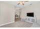 Comfortable living room featuring plush carpet and a view into the foyer and other living areas at 5021 Sweet Leaf Ct, Altamonte Springs, FL 32714