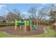 Community playground featuring a slide, tunnel and climbing apparatus with mature trees at 5021 Sweet Leaf Ct, Altamonte Springs, FL 32714