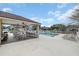 Community pool with covered lounge area featuring ceiling fans, chairs and barbecue at 5021 Sweet Leaf Ct, Altamonte Springs, FL 32714