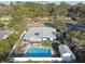 An aerial view of the property featuring a pool and well-maintained surroundings at 5073 Lake Howell Rd, Winter Park, FL 32792