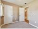 Bedroom features neutral carpeting, beige walls, closet and view into adjoining room at 5073 Lake Howell Rd, Winter Park, FL 32792