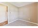 Neutral bedroom with beige walls, gray carpeting and view into adjoining room at 5073 Lake Howell Rd, Winter Park, FL 32792