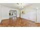 Dining room has hardwood floors, natural light, and an open view to the living room at 5073 Lake Howell Rd, Winter Park, FL 32792