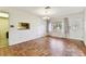 Dining area features hardwood floors, natural light, and view into the kitchen at 5073 Lake Howell Rd, Winter Park, FL 32792