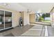 Enclosed lanai featuring neutral walls, a ceiling fan, and lots of natural light at 5073 Lake Howell Rd, Winter Park, FL 32792