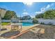 Backyard pool area with patio furniture and partially shaded spots for relaxing at 5073 Lake Howell Rd, Winter Park, FL 32792