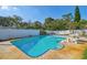 Spacious backyard featuring an in-ground pool and a white fence at 5073 Lake Howell Rd, Winter Park, FL 32792