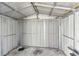 Empty metal shed featuring metal panels and a concrete floor at 5073 Lake Howell Rd, Winter Park, FL 32792