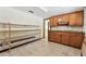 Unfinished storage room with built in cabinets and shelves at 5073 Lake Howell Rd, Winter Park, FL 32792