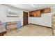 Unfinished storage room with built in wooden cabinets at 5073 Lake Howell Rd, Winter Park, FL 32792