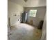 View of the laundry room showcasing water heater, window, and connections for a washing machine at 510 Lavon Dr, Altamonte Springs, FL 32701