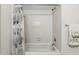 This bathroom has a tub with shower and a decorative curtain at 5849 Groveline Dr, Orlando, FL 32810