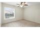 This bedroom offers a ceiling fan, neutral walls and plush carpet at 5849 Groveline Dr, Orlando, FL 32810