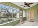 Enclosed porch for enjoying the outdoors at 5849 Groveline Dr, Orlando, FL 32810