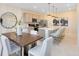 Dining area features modern pendant lighting, gray cabinets, and a kitchen island with seating at 6418 Tabebuia Pkwy, Winter Garden, FL 34787