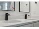 Bathroom vanity with double sinks, quartz countertop and black modern faucets at 6430 Sw 145Th Ln, Ocala, FL 34473