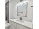 Bathroom featuring a sleek, modern vanity, matte black hardware, and gray tiled shower at 6430 Sw 145Th Ln, Ocala, FL 34473