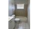 This bathroom features neutral tile, a shower-tub combo, and a single sink vanity at 709 Michigan Ct # 4, St Cloud, FL 34769