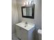 This bathroom features neutral tile, a shower-tub combo, and a single sink vanity at 709 Michigan Ct # 4, St Cloud, FL 34769