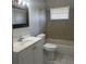 This bathroom features neutral tile, a shower-tub combo, and a single sink vanity at 709 Michigan Ct # 4, St Cloud, FL 34769