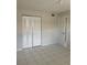 Bedroom featuring tile floors, neutral walls and a closet at 709 Michigan Ct # 4, St Cloud, FL 34769